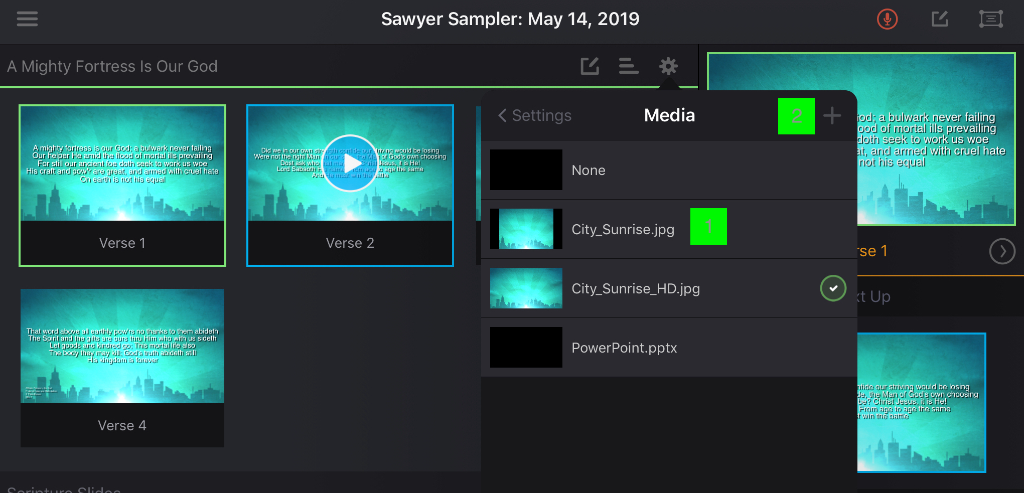 The Media list for the item, showing None, City_Sunrise.jpg, City_Sunrise_HD.jpg and PowerPoint.pptx, with the current background ticked and the + button marked